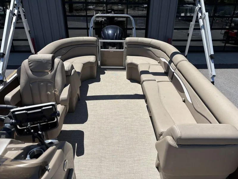 Slide: The Image of 2019 Bennington 23 SSRCX pontoon boat interior with beige seating and modern design. - 15