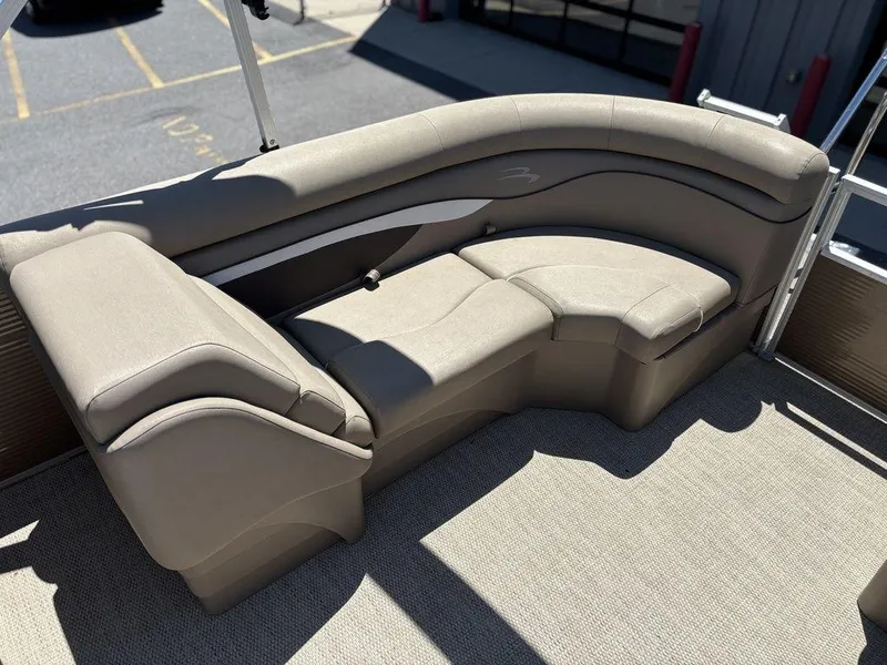 Slide: The Image of 2019 Bennington 23 SSRCX pontoon boat interior with beige seating and carpet. - 17