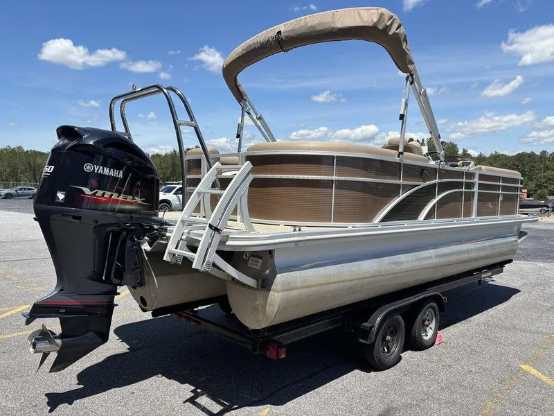 Slide: The Image of 2019 Bennington 23 SSRCX pontoon boat with Yamaha motor on trailer. - 4