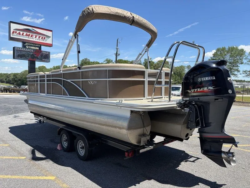 Slide: The Image of 2019 Bennington 23 SSRCX pontoon boat with Yamaha outboard motor on trailer. - 5