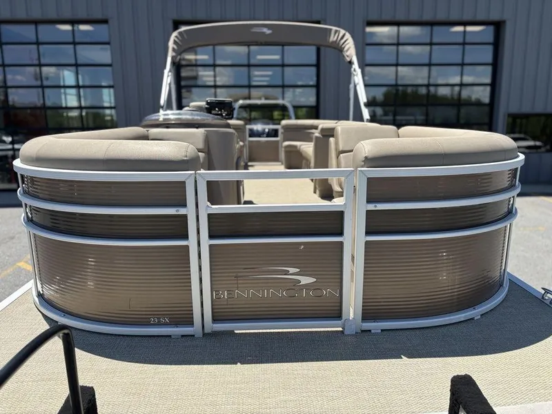 Slide: The Image of 2019 Bennington 23 SSRCX pontoon boat with beige seating and sleek design. - 6