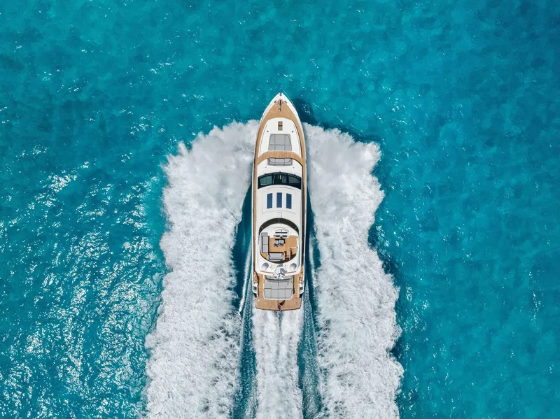 Slide: The Image of Aerial view of 2009 Princess Motor Yacht cruising on clear blue water. - 10