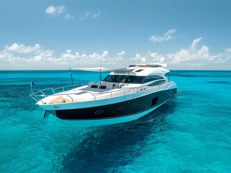 Slide: The Image of Luxurious 2009 Princess Motor Yacht cruising in clear turquoise waters under a sunny sky. - 15