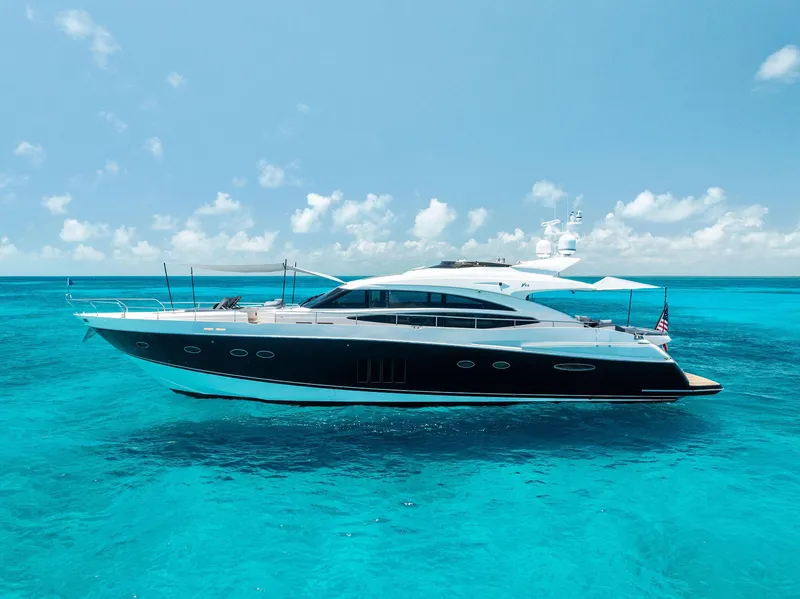 Slide: The Image of 2009 Princess Motor Yacht on clear turquoise water under a bright blue sky. - 16