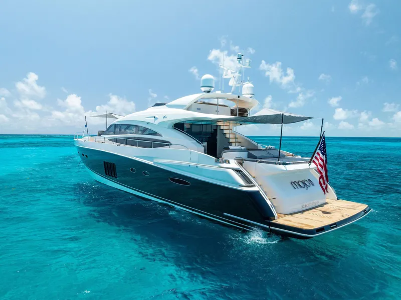 Slide: The Image of Luxurious 2009 Princess Motor Yacht on clear blue ocean waters. - 17