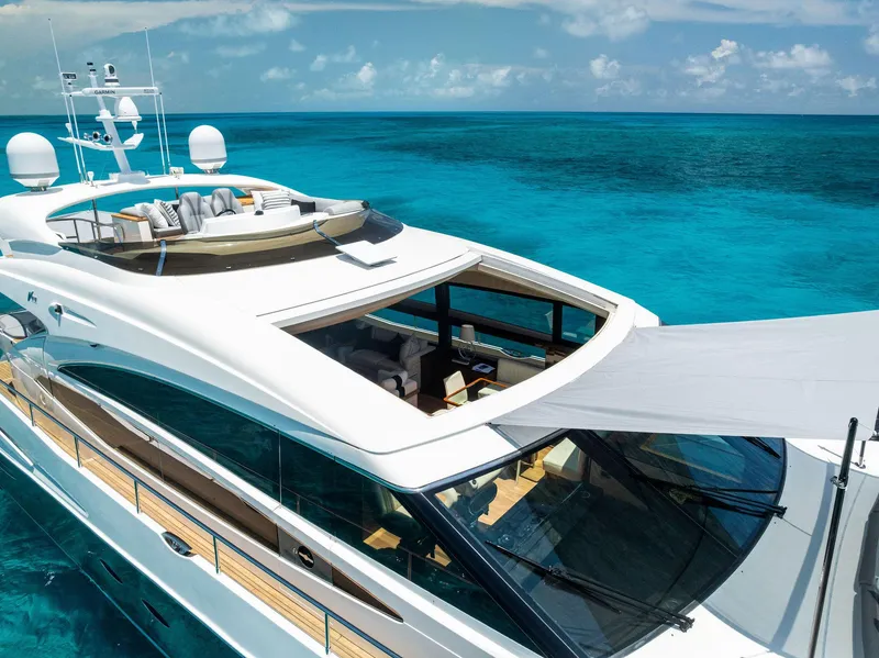 Slide: The Image of Luxurious 2009 Princess Motor Yacht cruising on clear turquoise waters. - 24