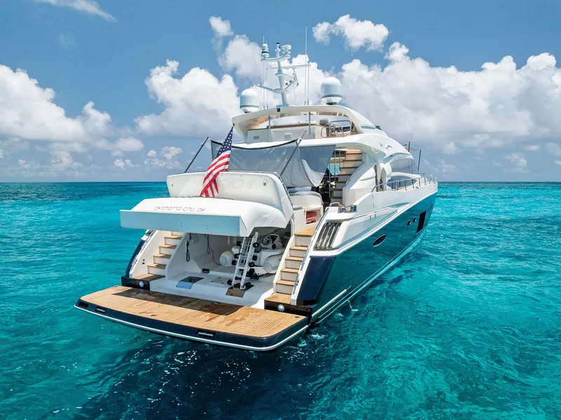 Slide: The Image of 2009 Princess Motor Yacht on clear blue ocean with American flag. - 27