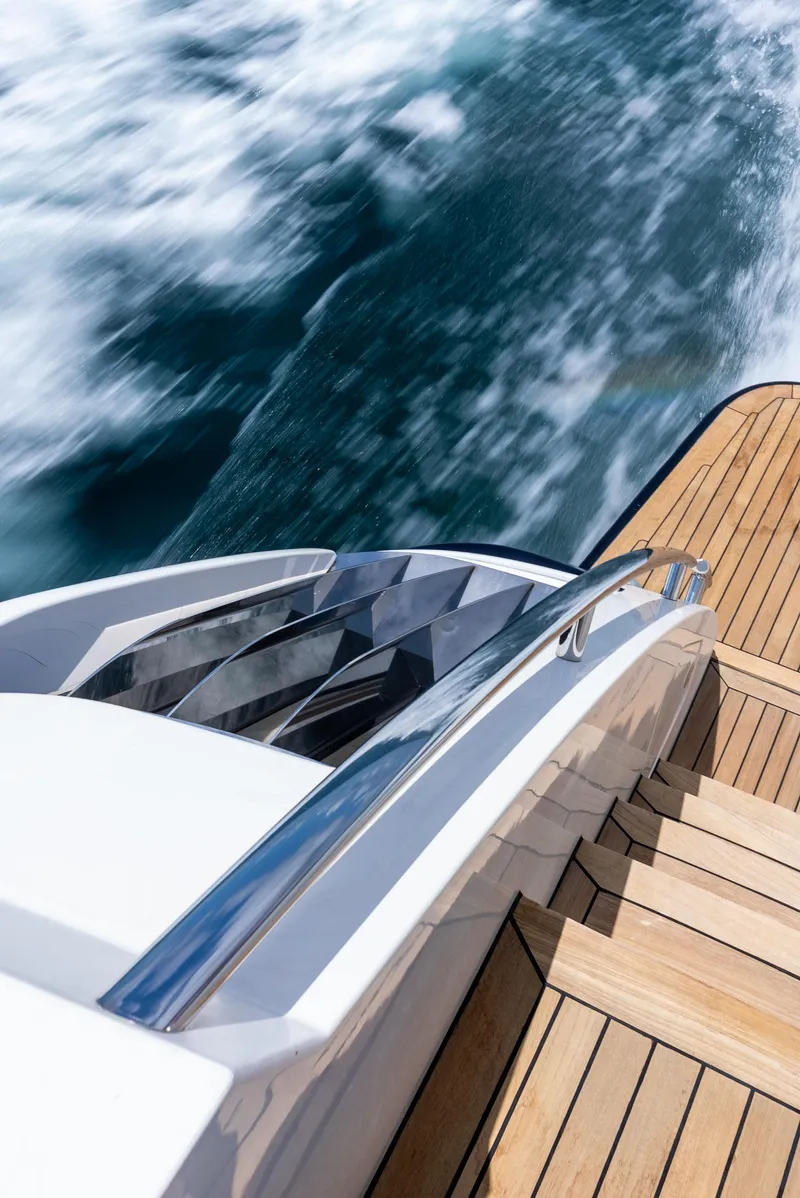 Slide: The Image of 2009 Princess Motor Yacht cruising with wooden deck and ocean waves. - 30