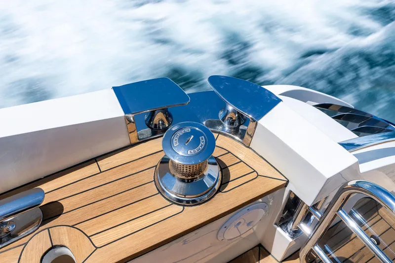 Slide: The Image of 2009 Princess Motor Yacht deck with polished chrome details and teak wood finish. - 31