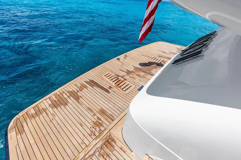 Slide: The Image of 2009 Princess Motor Yacht deck with ocean view and American flag. - 34