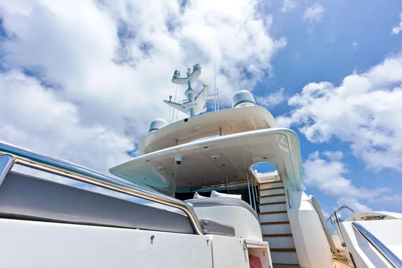 Slide: The Image of Luxurious 2009 Princess Motor Yacht under a bright blue sky with clouds. - 36