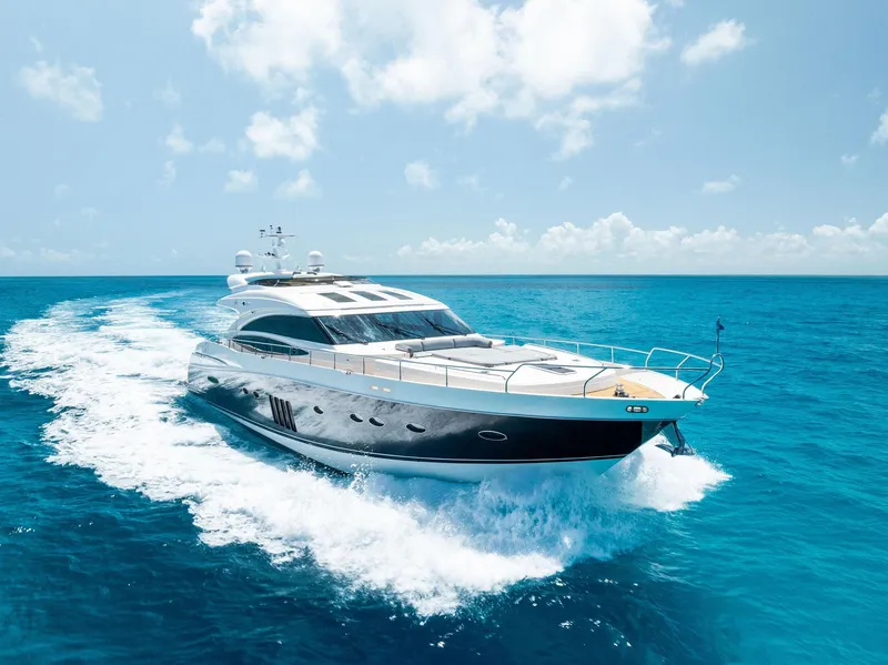 Slide: The Image of Luxurious 2009 Princess Motor Yacht cruising on clear blue ocean waters. - 4
