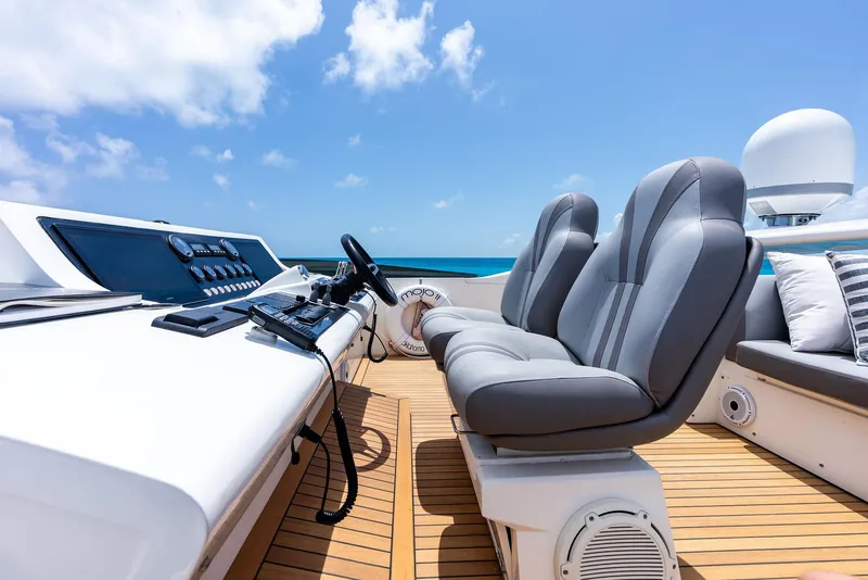 Slide: The Image of Luxurious 2009 Princess Motor Yacht helm with plush seating and ocean view. - 40