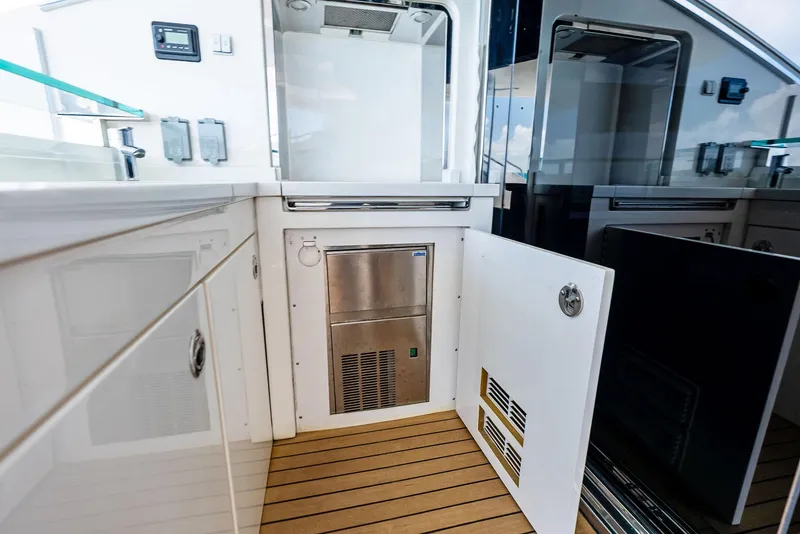 Slide: The Image of Interior of 2009 Princess Motor Yacht with open cabinet and modern appliances. - 44
