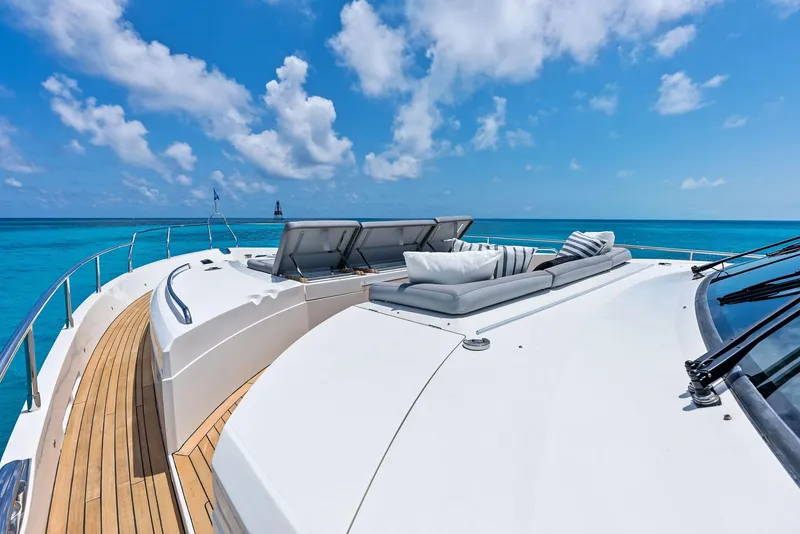 Slide: The Image of 2009 Princess Motor Yacht with sun loungers on deck, cruising in clear blue waters. - 45
