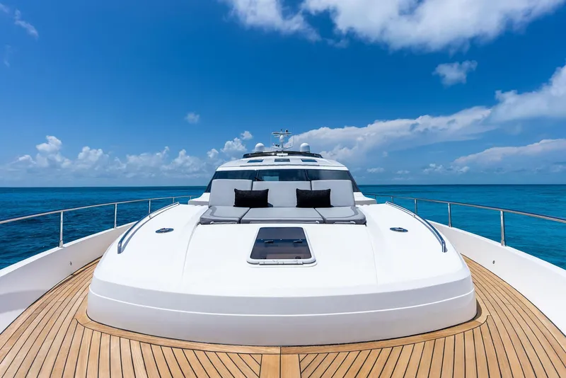 Slide: The Image of Luxurious 2009 Princess Motor Yacht on open sea under clear blue sky. - 48