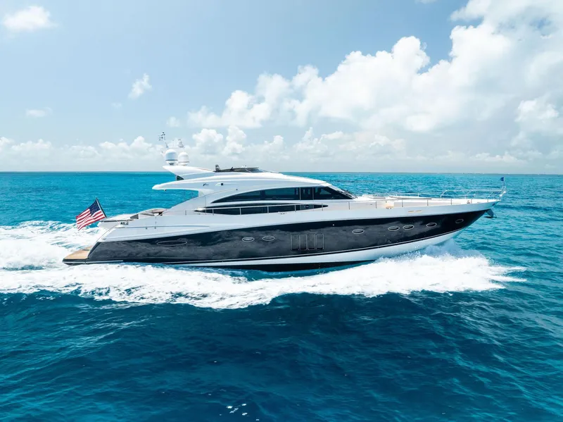 Slide: The Image of 2009 Princess Motor Yacht cruising on open sea under clear blue sky. - 5