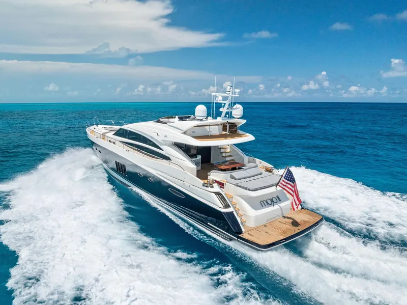 Slide: The Image of Luxurious 2009 Princess Motor Yacht cruising on open blue ocean under clear skies. - 7