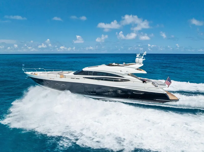 Slide: The Image of 2009 Princess Motor Yacht cruising on open ocean under clear blue sky. - 9