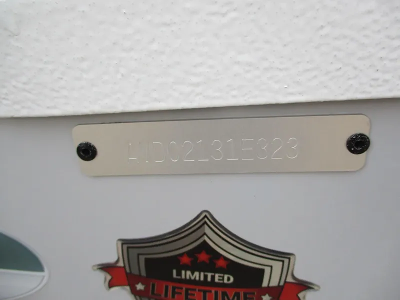 Slide: The Image of 2023 Avid 18 Rogue CC boat identification plate with limited lifetime warranty badge. - 12