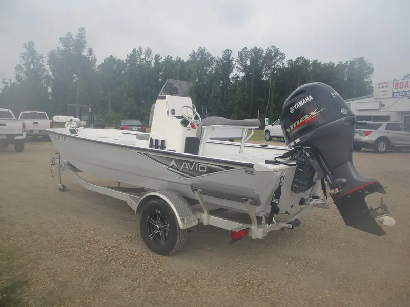Slide: The Image of 2023 Avid 18 Rogue CC boat with Yamaha outboard motor on a trailer. - 3
