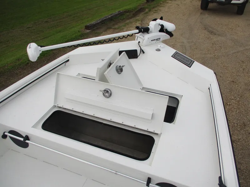 Slide: The Image of 2023 Avid 18 Rogue CC boat deck with storage compartments and trolling motor. - 6