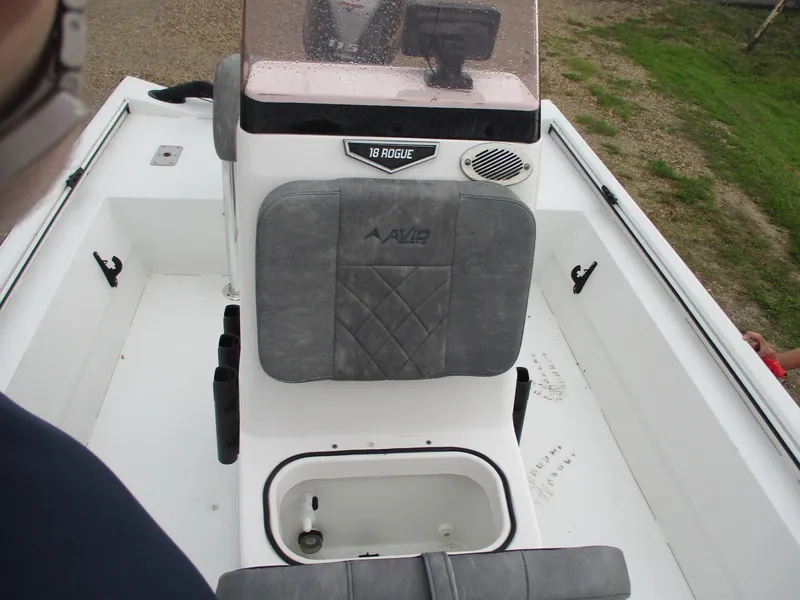 Slide: The Image of 2023 Avid 18 Rogue CC boat interior with seating and storage compartment. - 7