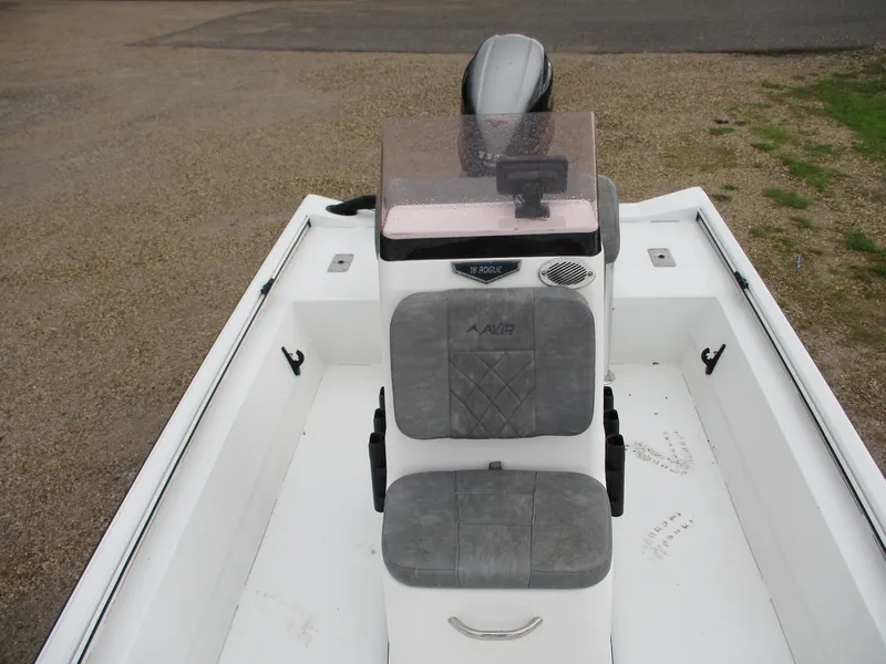 Slide: The Image of 2023 Avid 18 Rogue CC boat interior with gray seating and console. - 8