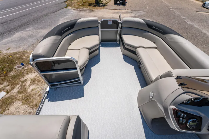 Slide: The Image of 2021 South Bay 224FCR pontoon boat interior with spacious seating and modern dashboard. - 12