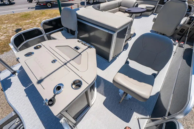 Slide: The Image of 2021 South Bay 224FCR boat interior with seating and control panel. - 16
