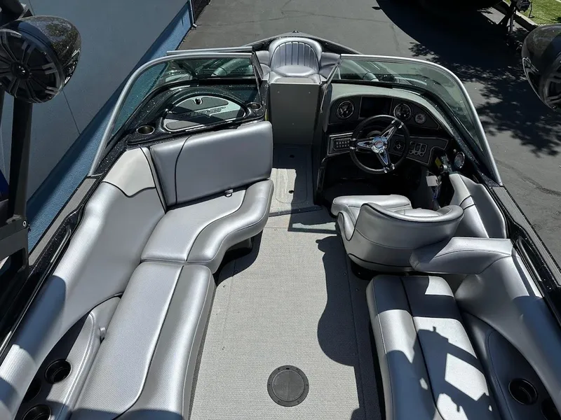 Slide: The Image of 2025 Sanger V215 SX boat interior with sleek seating and modern dashboard design. - 10