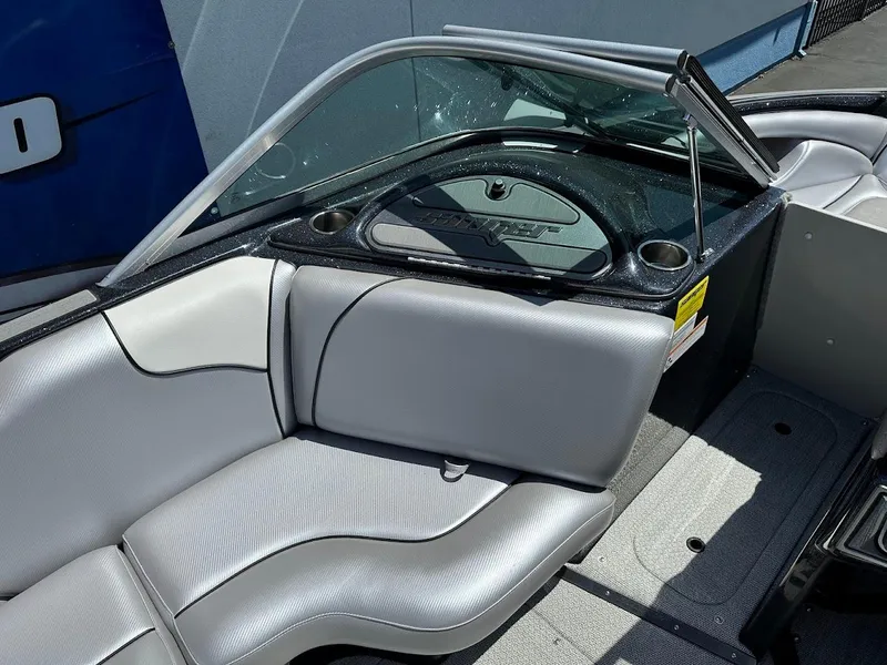 Slide: The Image of 2025 Sanger V215 SX boat interior with sleek silver seating and modern dashboard design. - 19