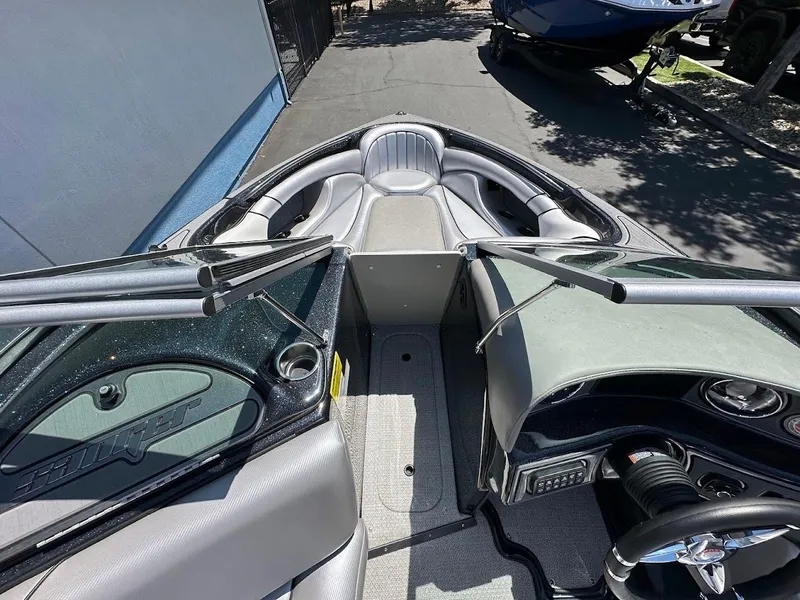 Slide: The Image of 2025 Sanger V215 SX boat interior with sleek seating and modern dashboard design. - 20