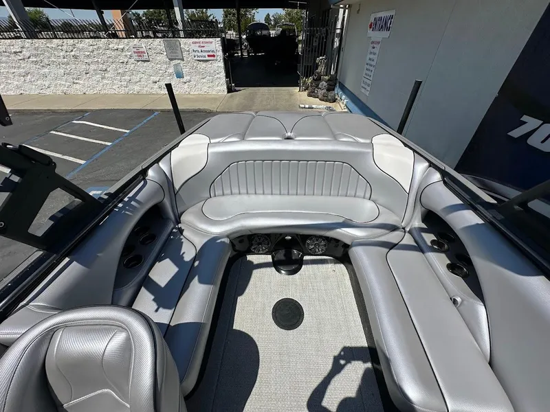 Slide: The Image of 2025 Sanger V215 SX boat interior with gray seating and modern design. - 7