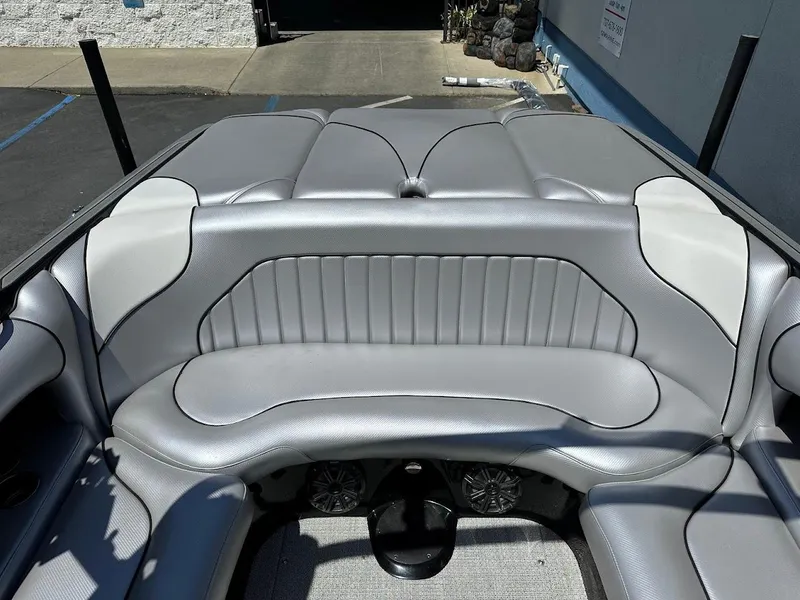 Slide: The Image of 2025 Sanger V215 SX boat interior with gray and white seating, showcasing modern design. - 8