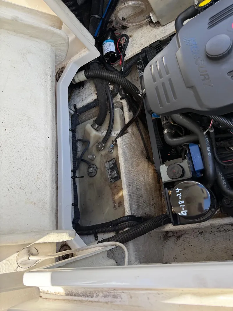 Slide: The Image of Engine compartment of a 2008 Regal 2750 boat, showing wiring and components. - 12
