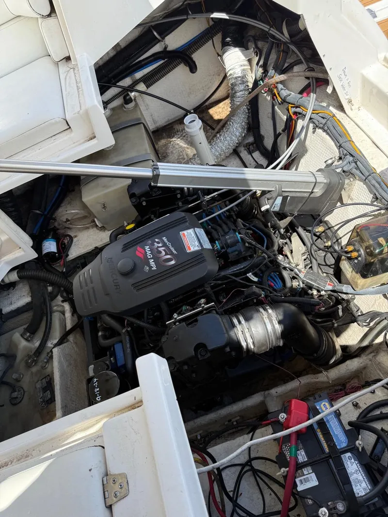 Slide: The Image of 2008 Regal 2750 boat engine compartment with visible components and wiring. - 16