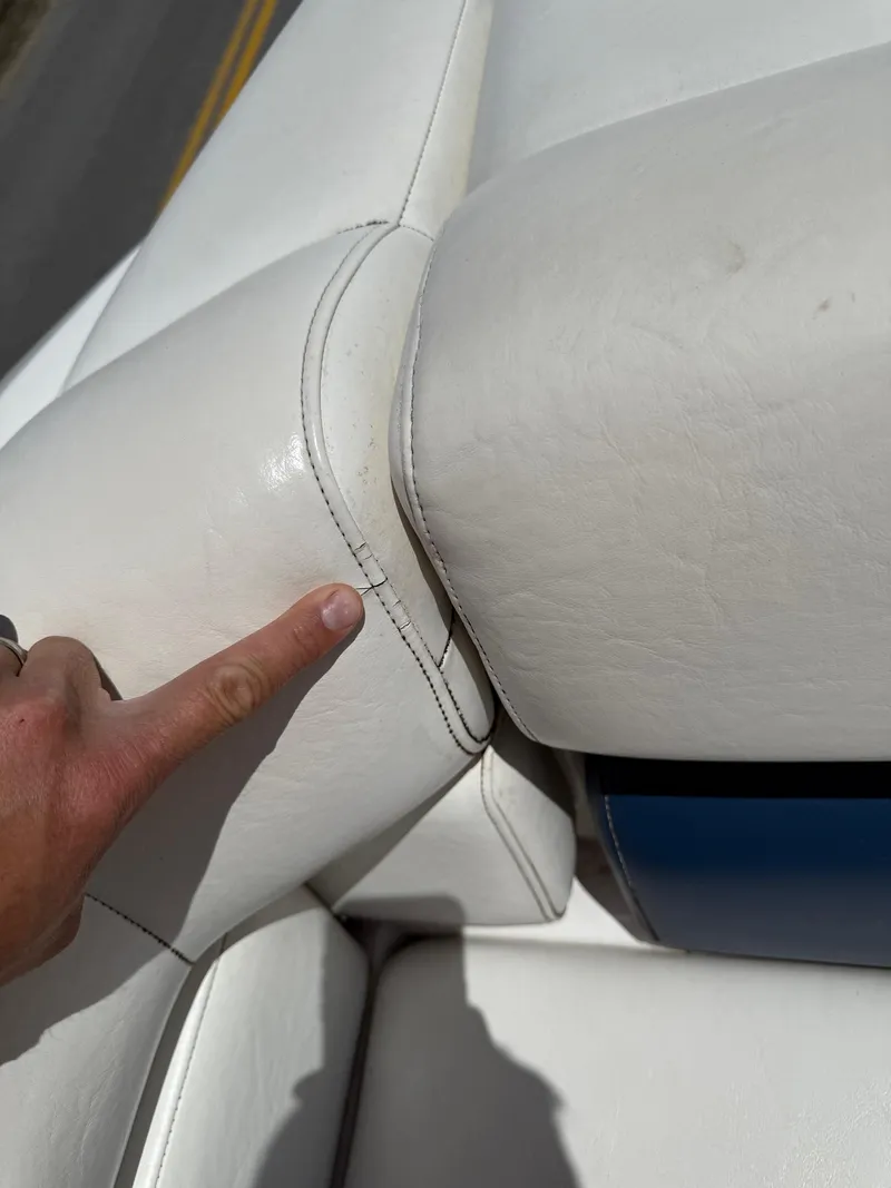 Slide: The Image of Close-up of a 2008 Regal 2750 boat's white leather upholstery with visible stitching. - 22