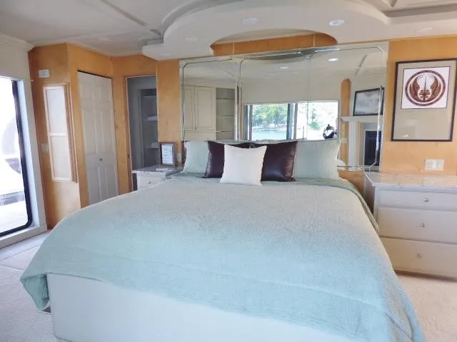 Slide: The Image of Luxurious bedroom in 2001 Sumerset 20x103 houseboat with elegant decor and large bed. - 11