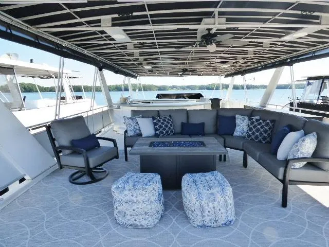 Slide: The Image of Luxurious 2001 Sumerset 20x103 houseboat with spacious outdoor seating and scenic lake view. - 15