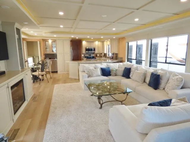 Slide: The Image of Luxurious Sumerset 20x103 houseboat interior with spacious living area, modern kitchen, and elegant decor. - 2