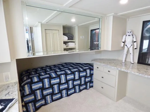 Slide: The Image of Cozy bedroom in 2001 Sumerset 20x103 houseboat with modern decor and Stormtrooper figure. - 9
