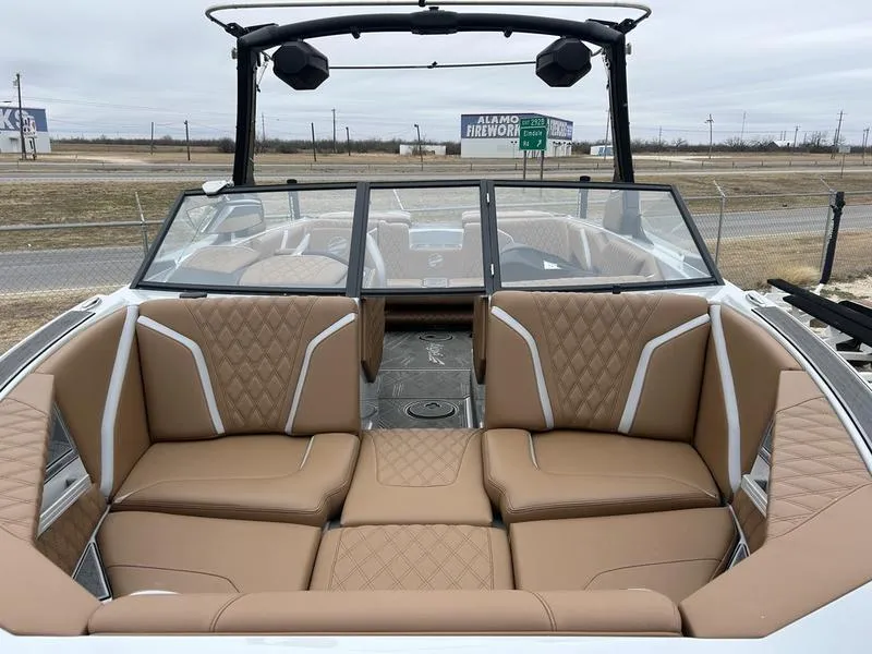 Slide: The Image of 2024 Tigé 22RZX boat interior with tan leather seating and modern design. - 3