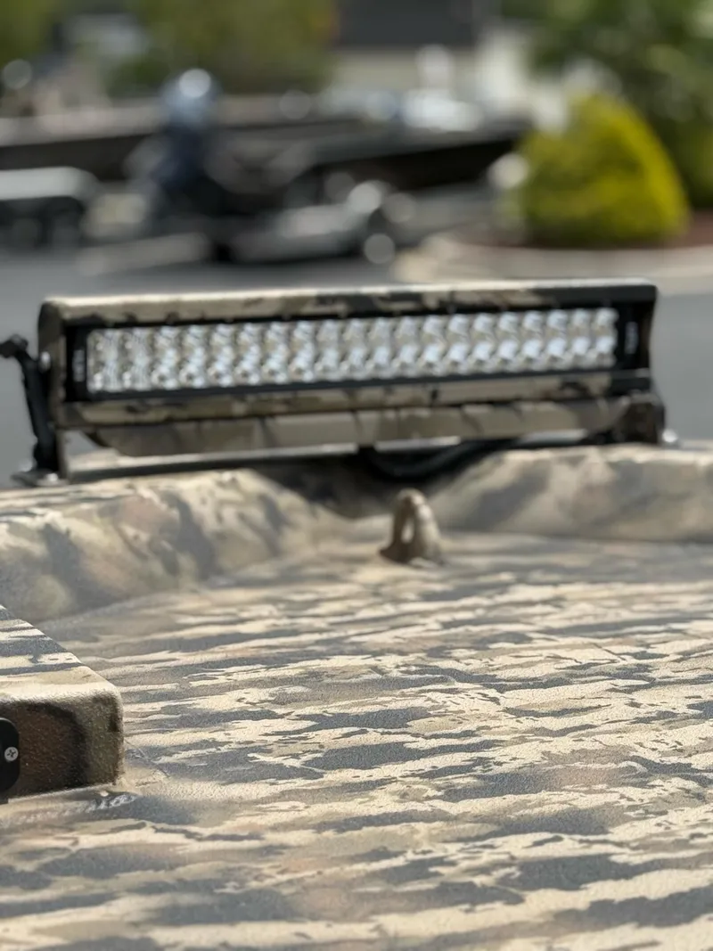 Slide: The Image of 2025 Excel 1651 Viper F4 boat with camouflage pattern and LED light bar. - 10