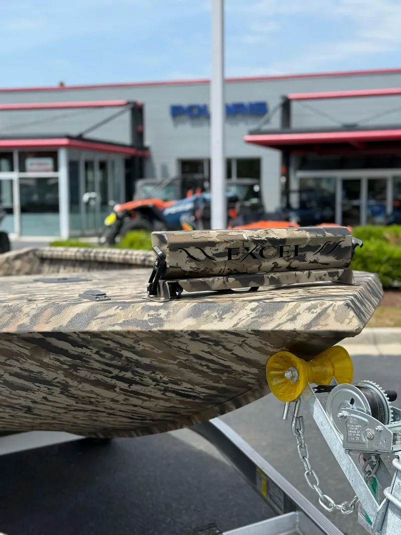 Slide: The Image of 2025 Excel 1651 Viper F4 boat with camouflage design on a trailer. - 14