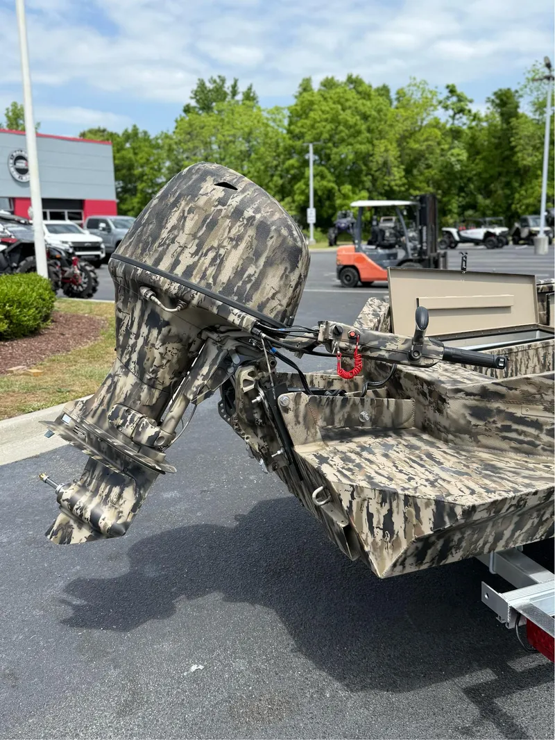 Slide: The Image of 2025 Excel 1651 Viper F4 boat with camouflage design and outboard motor. - 3