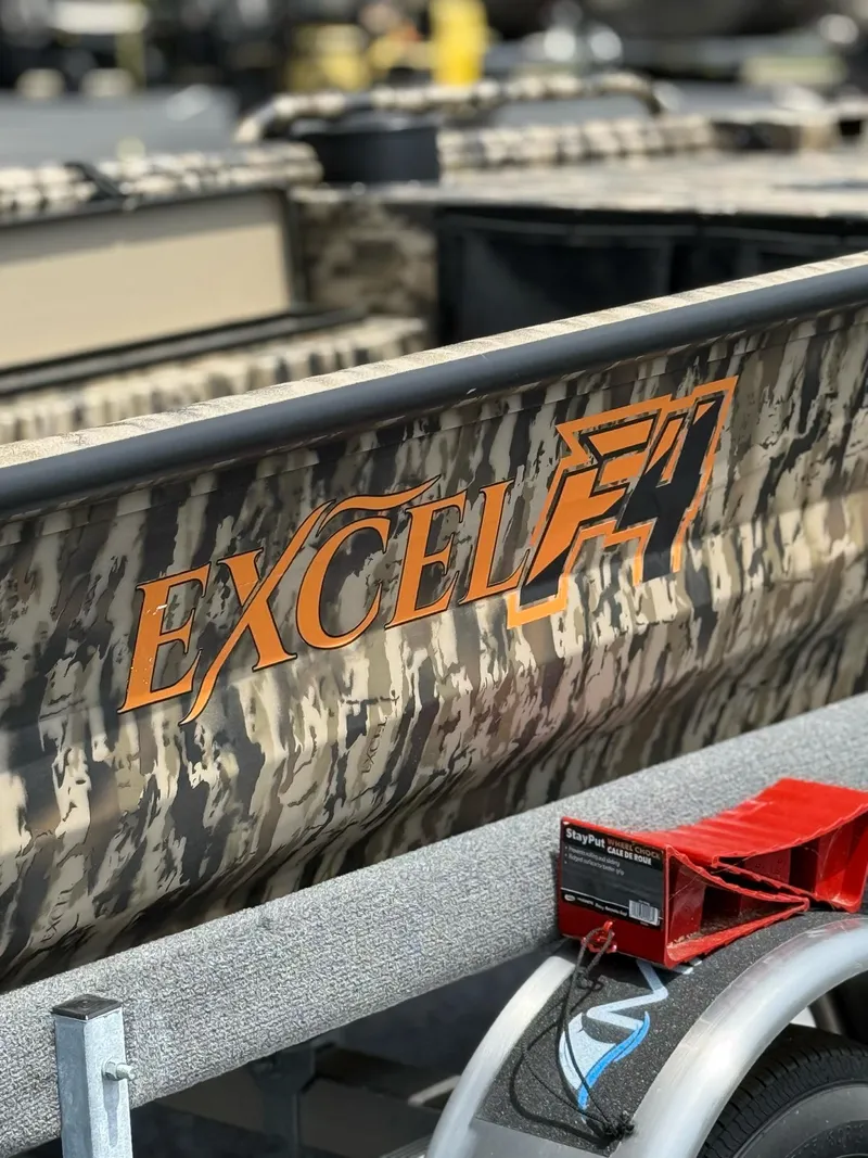 Slide: The Image of 2025 Excel 1651 Viper F4 boat with camouflage design on a trailer. - 4