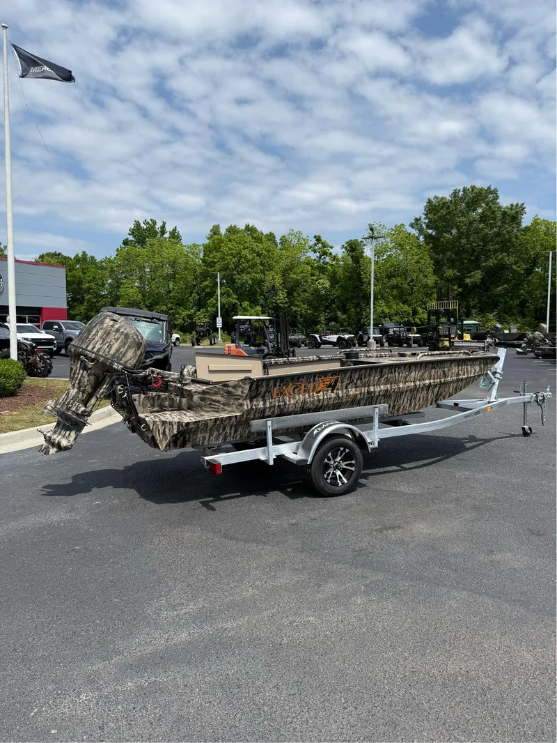 Slide: The Image of 2025 Excel 1651 Viper F4 boat on trailer, camo design, parked outdoors. - 5
