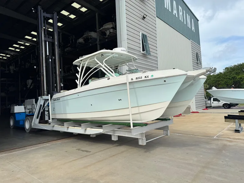 The Image of 2018 World Cat Glacier Bay Edition 2740 Dual Console boat at marina storage facility. - 0