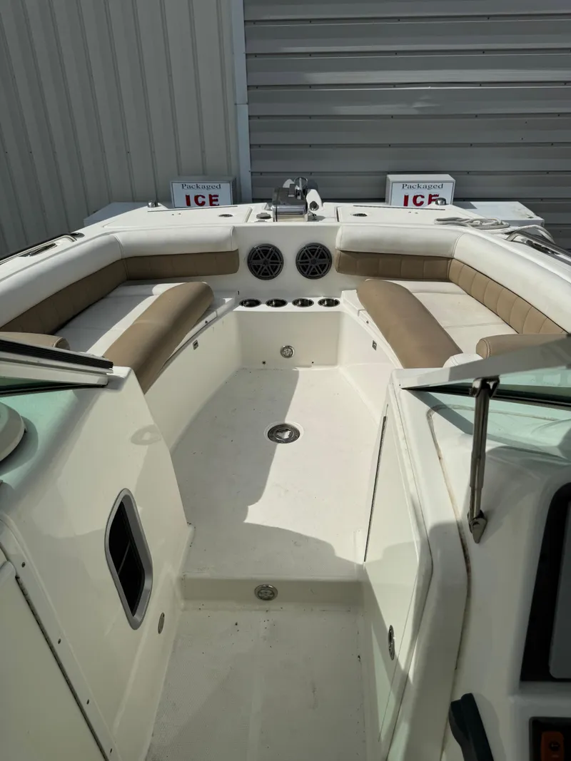 Slide: The Image of 2018 World Cat Glacier Bay Edition 2740 Dual Console boat interior with seating and storage. - 10